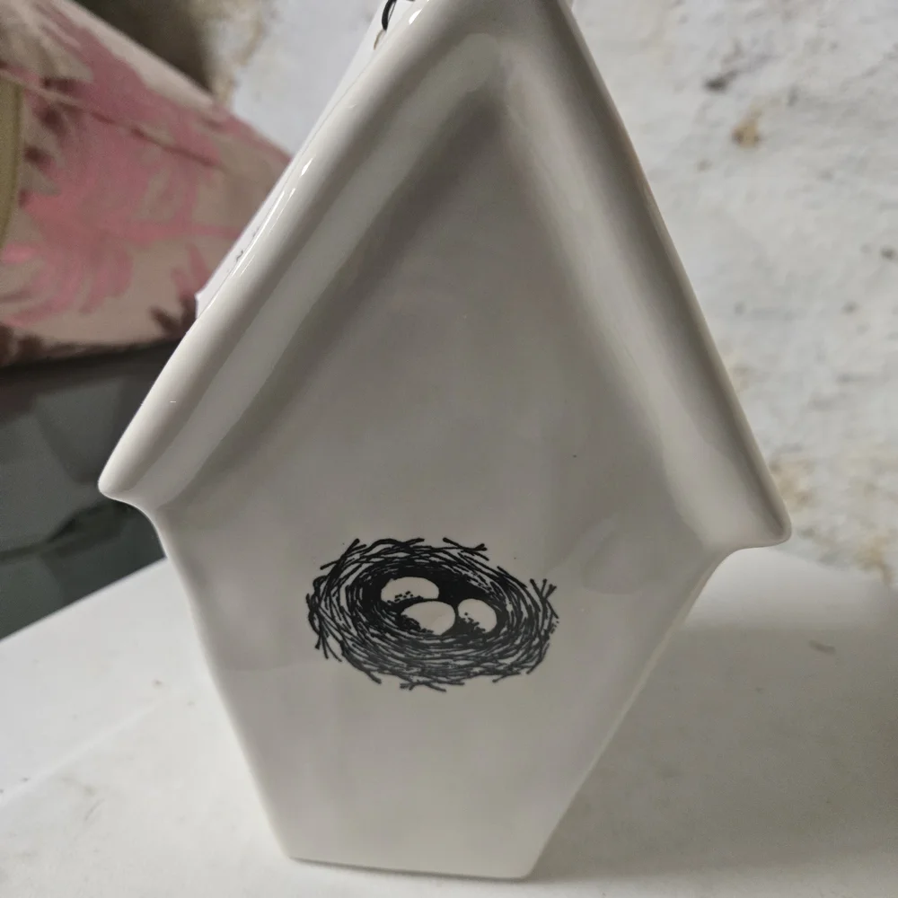 White Ceramic Birdhouse with 'Rest' Inscription
